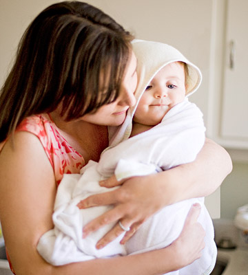 mother holding baby