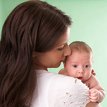 mother holding baby