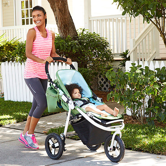 Mom pushing baby in stroller