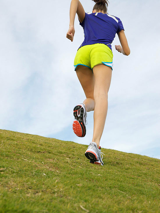 woman running up a hill