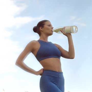 Woman Drinking Water After Workout