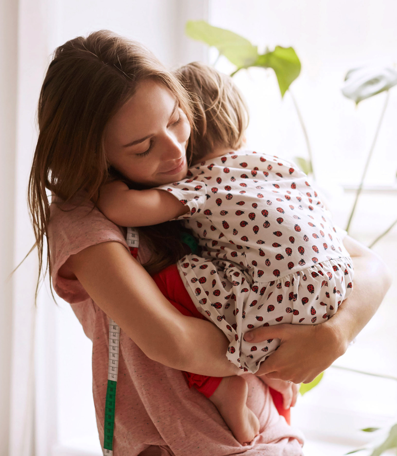 woman holding a child smiling