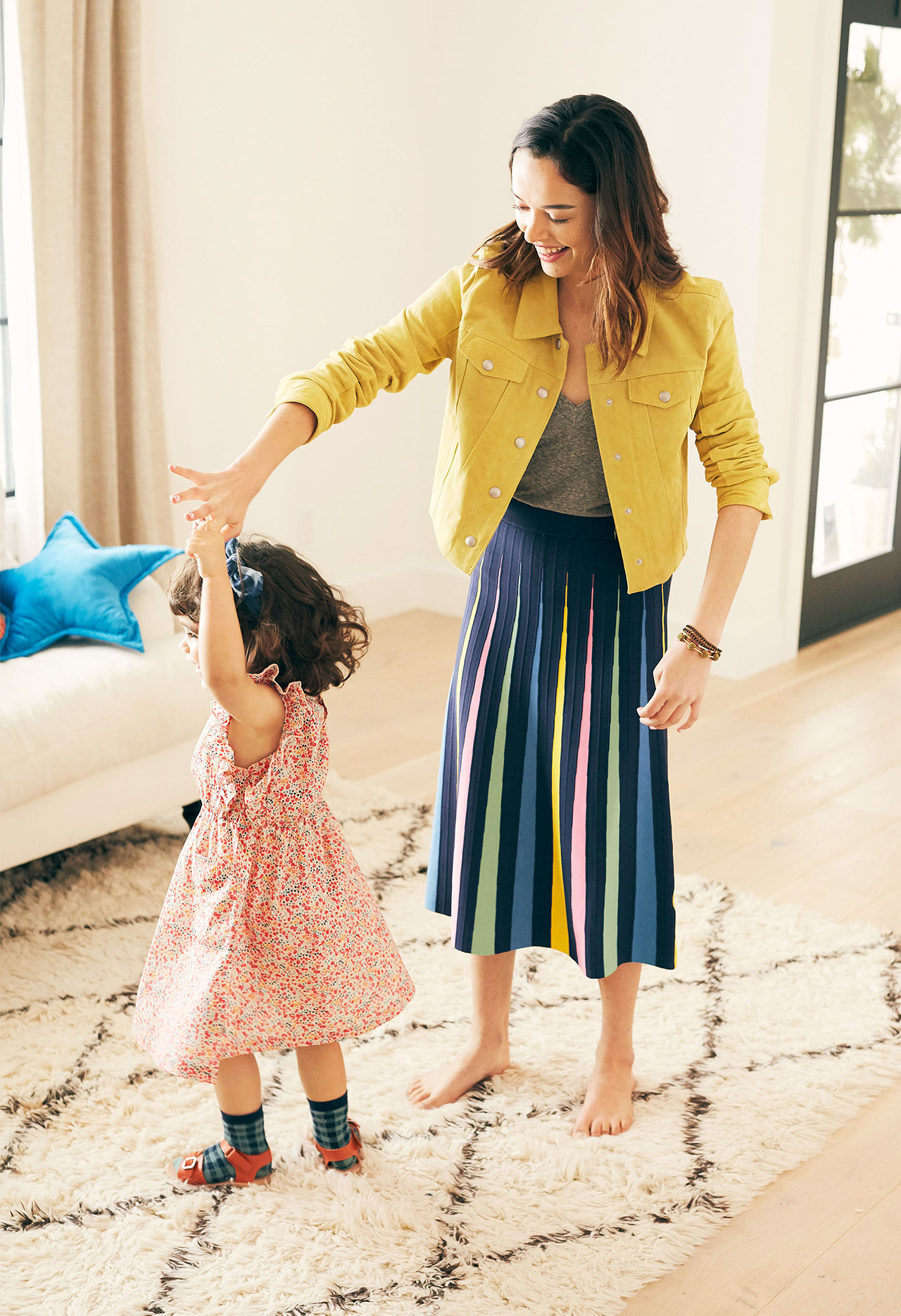 mother twirling daughter