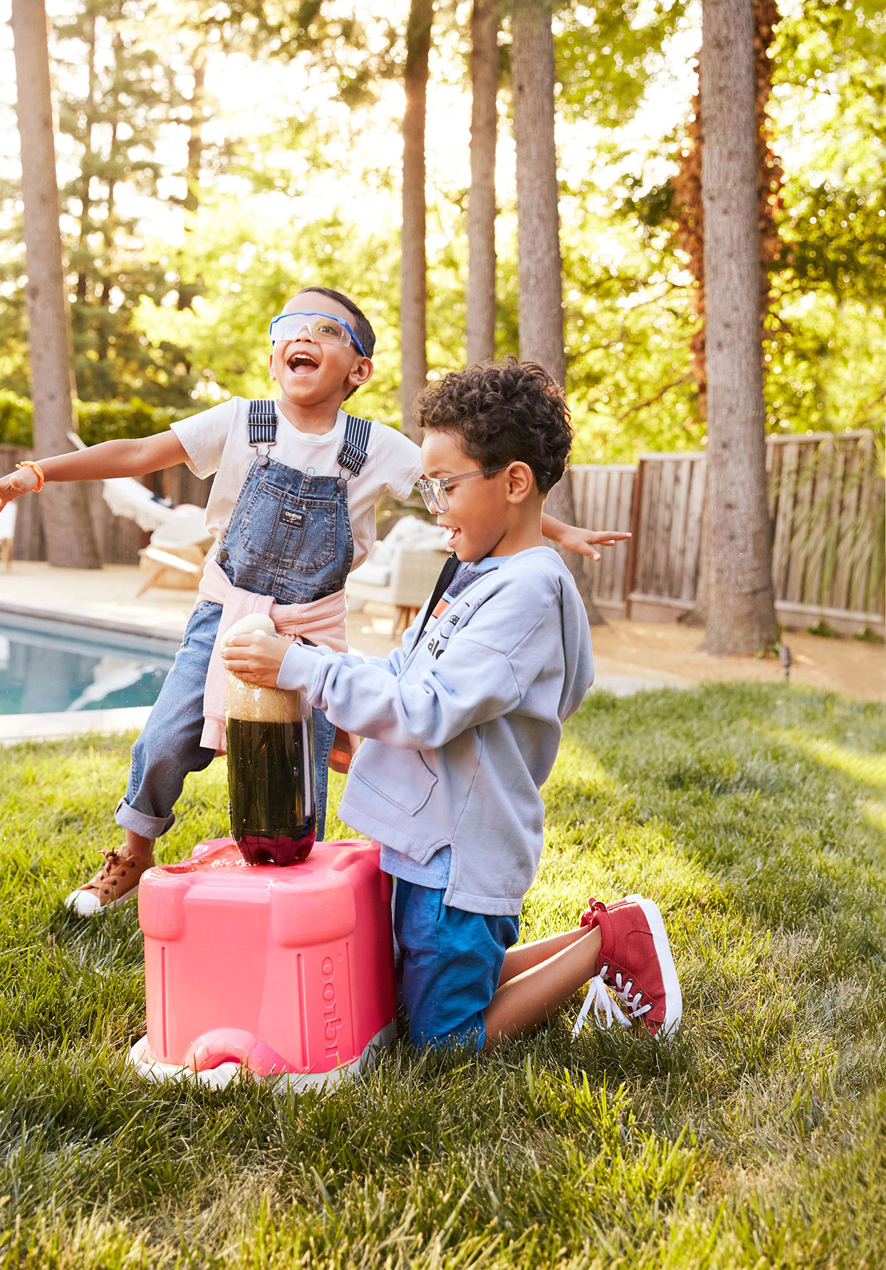 Children doing science experiment in yard