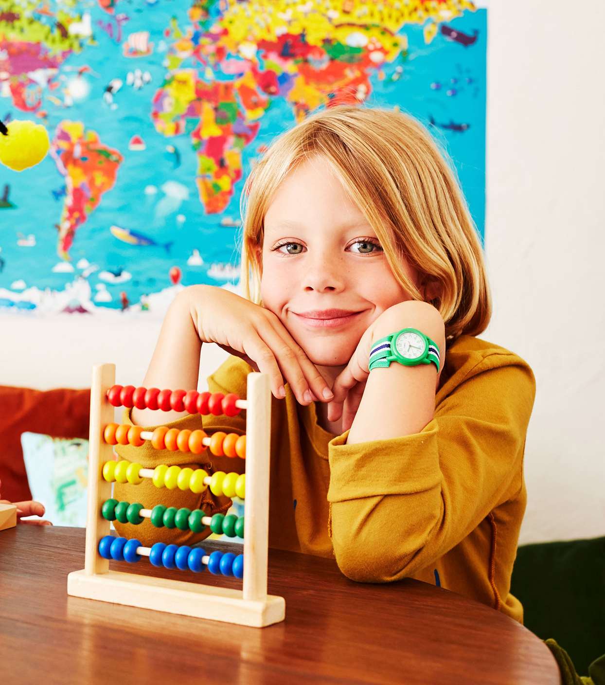 Child with rainbow abacus